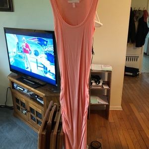 Coral colored form fitting maxi dress